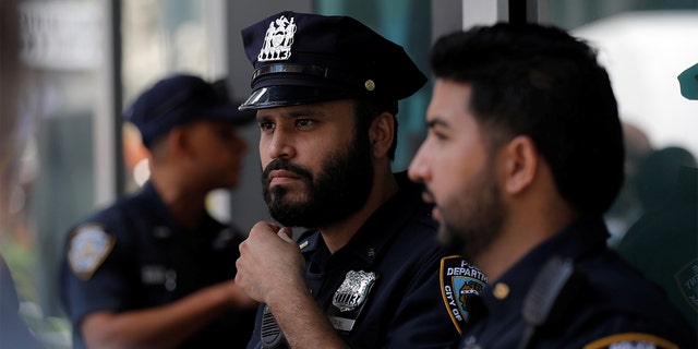 Officers from the New York City Police Department stand in Times Square in Manhattan, New York City, Aug. 19, 2021.