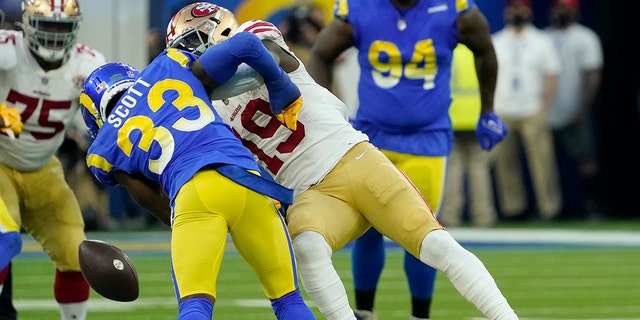 San Francisco 49ers' Deebo Samuel (19) cannot catch a pass after being hit by Los Angeles Rams' Nick Scott (33) during the first half of the NFC Championship NFL football game Sunday, Jan. 30, 2022, in Inglewood, Calif.