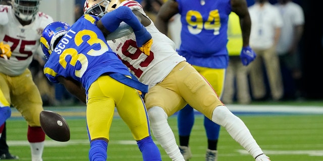 San Francisco 49ers' Deebo Samuel (19) cannot catch a pass after being hit by Los Angeles Rams' Nick Scott (33) during the first half of the NFC Championship NFL football game Sunday, Jan. 30, 2022, in Inglewood, Calif.