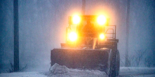 Plow in whiteout, East Squantum St. during the snowstorm in Quincy, MA on Jan. 29, 2022.