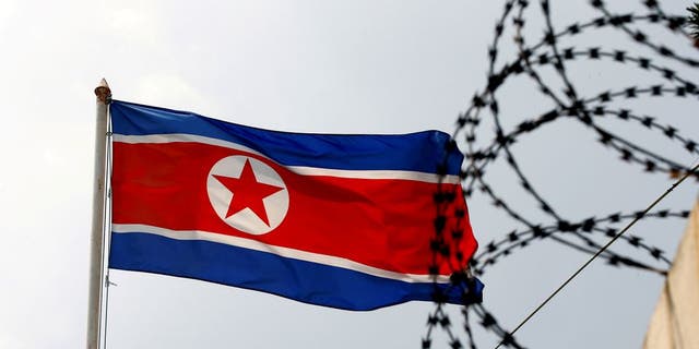 A North Korea flag flutters next to concertina wire at the North Korean embassy in Kuala Lumpur, Malaysia, on March 9, 2017.