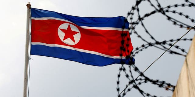 A North Korea flag flutters next to concertina wire at the North Korean embassy in Kuala Lumpur, Malaysia March 9, 2017.