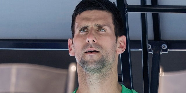 Defending men's champion Serbia's Novak Djokovic rests during a practice session on Margaret Court Arena ahead of the Australian Open tennis championship in Melbourne, Australia, on Jan. 13, 2022.