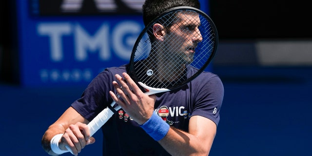 Defending men's champion Novak Djokovic of Serbia practices at Rod Laver Arena ahead of the Australian Open tennis championship in Melbourne, Australia, Jan. 12, 2022.