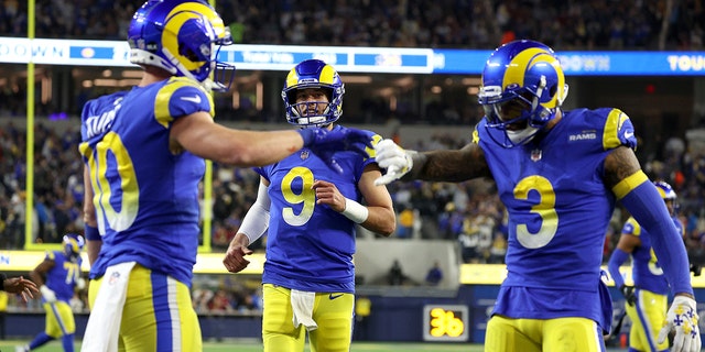 Matthew Stafford #9 of the Los Angeles Rams celebrates his touchdown pass to Cooper Kupp #10 of the Los Angeles Rams during the third quarter against the Arizona Cardinals in the NFC Wild Card Playoff game at SoFi Stadium on January 17, 2022 in Inglewood, California.