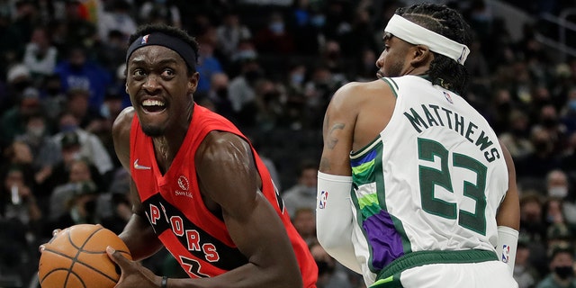 Toronto Raptors' Pascal Siakam drives to the basket against Milwaukee Bucks' Wesley Matthews (23) during the first half of an NBA basketball game Wednesday, Jan. 5, 2022, in Milwaukee.
