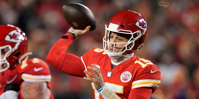 Kansas City Chiefs quarterback Patrick Mahomes (15) throws a pass during the first half of an NFL divisional round playoff football game against the Buffalo Bills, Sunday, Jan. 23, 2022, in Kansas City, Mo.