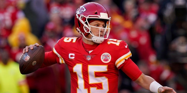 Kansas City Chiefs quarterback Patrick Mahomes (15) looks for a pass during the first half of the AFC Championship NFL football game against the Cincinnati Bengals on Sunday, January 30, 2022. , in Kansas City, Missouri.