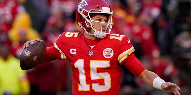 Kansas City Chiefs quarterback Patrick Mahomes looks for a pass during the first half of the AFC Championship game against Cincinnati Bengal on January 30, 2022 in Kansas City, Missouri.