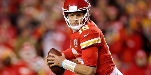 Patrick Mahomes #15 of the Kansas City Chiefs looks to pass against the Buffalo Bills during the second quarter in the AFC Divisional Playoff game at Arrowhead Stadium on January 23, 2022 in Kansas City, Missouri.
