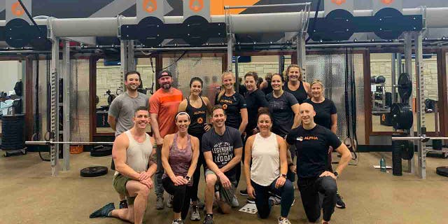 Osland is pictured with her Life Time Alpha Strong group, which she joined in February last year.