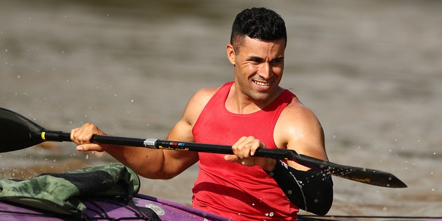 Pita Taufatofua trains at Jindalee Boat Ramp on December 23, 2021 in Brisbane, Australia. 