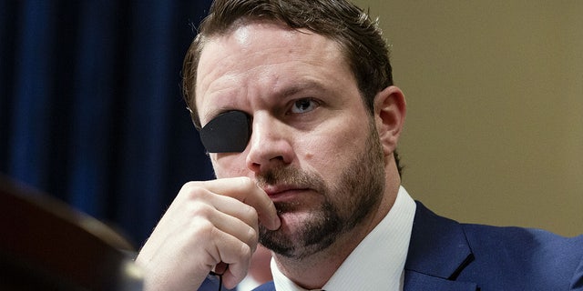 Representative Dan Crenshaw, a Republican from Texas, listens during a House Homeland Security Committee hearing in Washington, D.C., U.S., on Wednesday, June 26, 2019. Google's global director of information policy testified Wednesday that no single employee could skew search results based on her political beliefss.