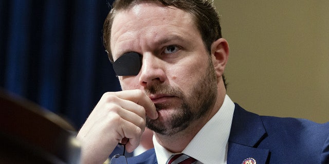 Representative Dan Crenshaw, a Republican from Texas, listens during a House Homeland Security Committee hearing in Washington, D.C., U.S., on Wednesday, June 26, 2019. Google's global director of information policy testified Wednesday that no single employee could skew search results based on her political beliefss.