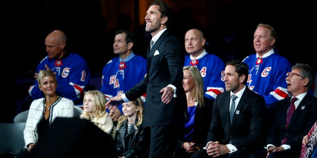 Former New York Rangers goaltender Henrik Lundqvist, center, watches as his number is retired before an NHL hockey game between the Rangers and the Minnesota Wild Friday, Jan. 28, 2022 in New York. He was joined by four former Rangers who have also had their number retired, from left, Mark Messier, Mike Richter, Adam Graves and Brian Leetch.