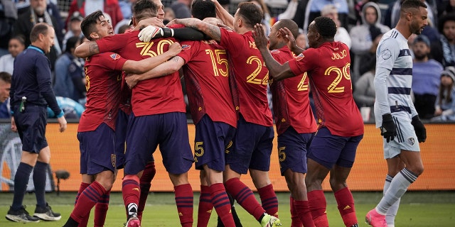Real Salt Lake players celebrate after a win over Sporting Kansas City in the conference semifinals of the 2021 MLS playoffs at Children's Mercy Park in November 2021.