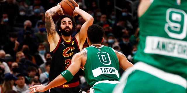 Ricky Rubio #3 of the Cleveland Cavaliers looks to pass as Jayson Tatum #0 of the Boston Celtics defends during the second quarter of the game at TD Garden on December 22, 2021 in Boston, Massachusetts.