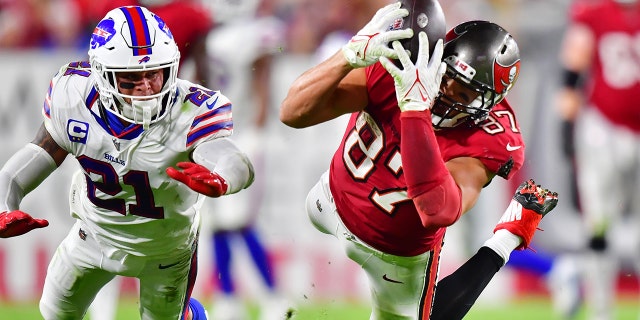 Rob Gronkowski (87) of the Tampa Bay Buccaneers attempts to catch a ball thrown by Tom Brady during the second half against the Buffalo Bills at Raymond James Stadium on Dec. 12, 2021, a Tampa, Florida.