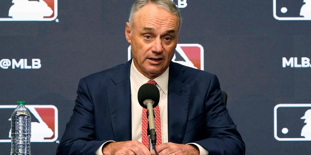 Major League Baseball Commissioner Rob Manfred speaks during a news conference in Arlington, Texas, Dec. 2, 2021.