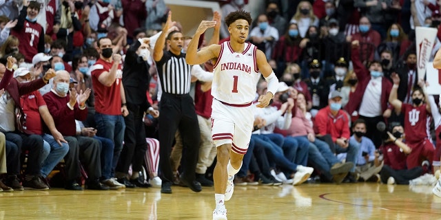 Indiana's Rob Phinisee (1) reacts after hitting a three-point basket during the first half of an NCAA college basketball game against Purdue, Thursday, Jan. 20, 2022, in Bloomington, Ind.
