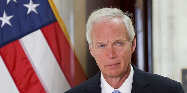 Sen. Ron Johnson (R-WI) arrives to a news conference.