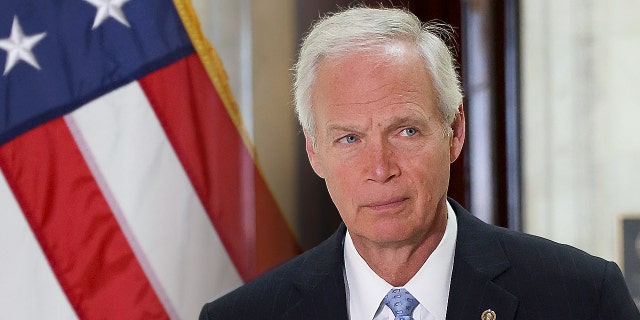 Sen. Ron Johnson (R-WI) arrives at a news conference.