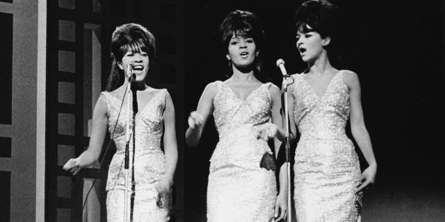 The Ronettes perform on stage in 1963.