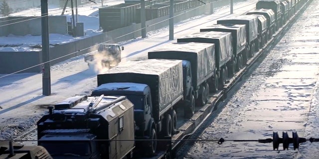 Russian military vehicles on a railway platform on their way to attend joint military drills in Belarus, in Russia, on Monday. Russia has sent an unspecified number of troops from the country's far east to its ally Belarus, which shares a border with Ukraine, for major war games next month. 