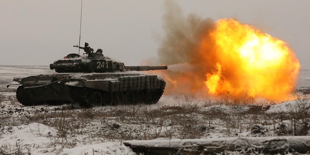 A Russian tank T-72B3 fires as troops take part in drills at the Kadamovskiy firing range in the Rostov region in southern Russia, Wednesday, Jan. 12, 2022. 