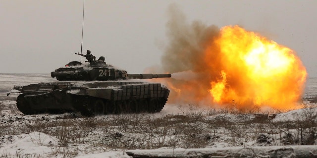 A Russian tank T-72B3 fires as troops take part in drills at the Kadamovskiy firing range in the Rostov region in southern Russia, Wednesday, Jan. 12, 2022.