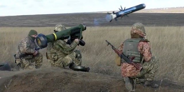 Ukrainian soldiers use a launcher with U.S. Javelin missiles during military exercises in Donetsk region, Ukraine, Wednesday, Jan. 12, 2022. (Ukrainian Defense Ministry Press Service via G3 Box News)