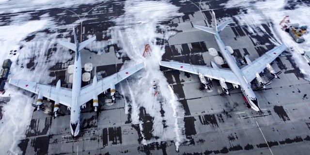 A pair of Tu-95 strategic bombers of the Russian air force are parked at an air base in Engels near the Volga River in Russia on Monday.
