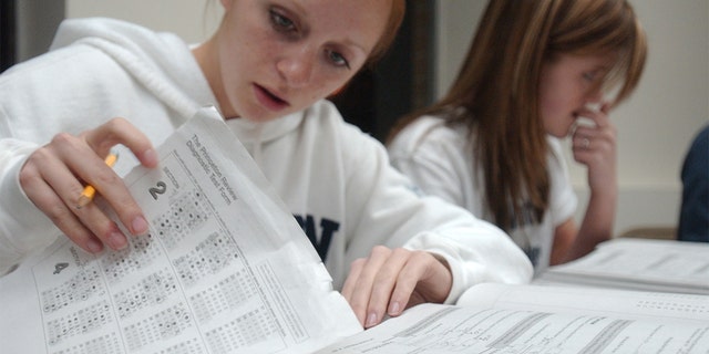Nicole M. McCoy, 17, left, of Wernersville, and Kerri B. Orzechowski, 17, of Sinking Spring, taking a SAT prep course in Pennsylvania.
