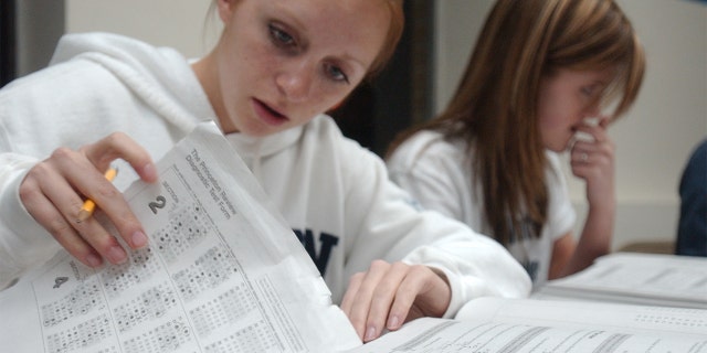 Nicole M. McCoy, 17, left, of Wernersville, and Kerri B. Orzechowski, 17, of Sinking Spring, taking a SAT prep course in Pennsylvania.