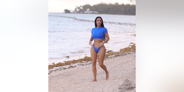 Kim Kardashian put her curves on display in a bright blue swimsuit earlier this week.