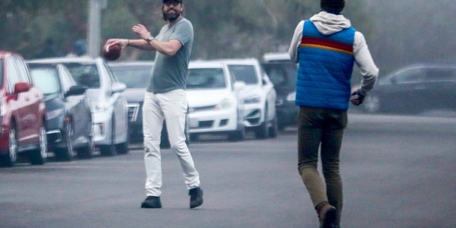 Owens seemed in good spirits as he was not wearing his wedding ring while playing ball with a pal.