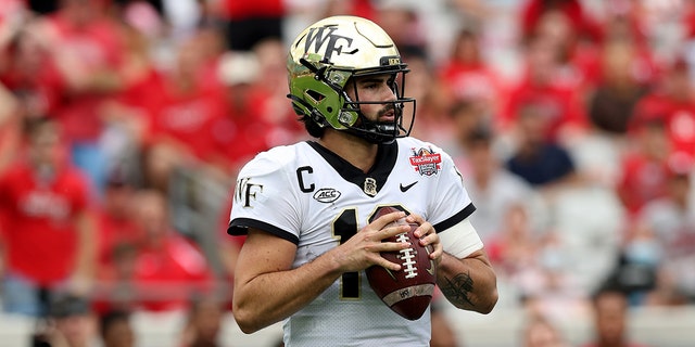 Wake Forest Demon Deacon Sam Hartman #10 looks set to take on the Rutgers Scarlet Knights at the TaxSlayer Gator Bowl at TIAA Bank Field on December 31, 2021 in Jacksonville, Florida.