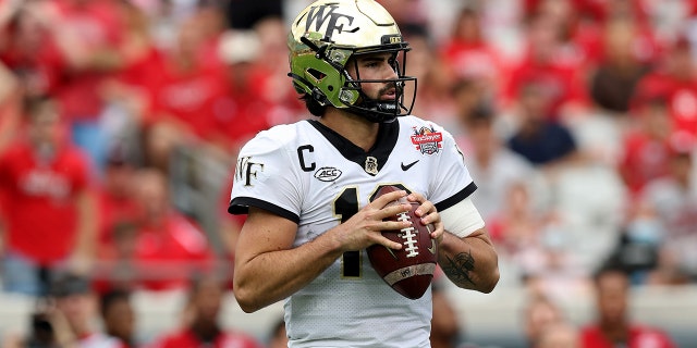 Wake Forest Demon Deacon Sam Hartman #10 looks set to take on the Rutgers Scarlet Knights at the TaxSlayer Gator Bowl at TIAA Bank Field on December 31, 2021 in Jacksonville, Florida.