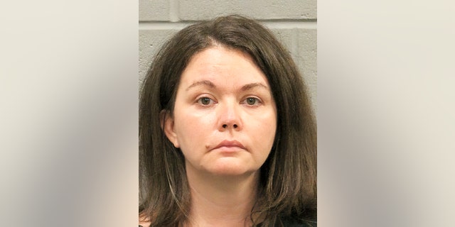 Sarah Beam, 42, was charged with child endangerment after her COVID-19 positive teen son was found in the trunk of her car at a Houston-area testing site. But a judge found no probable cause for her arrest.