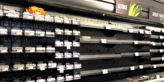 Produce shelves sit vacant as winter storms and supply chain snafus slow the delivery of new groceries.