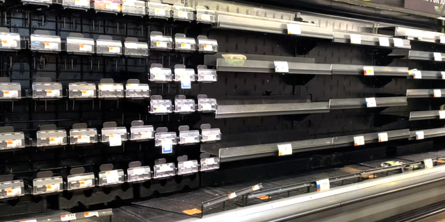 Produce shelves sit vacant as winter storms and supply chain snafus slow the delivery of new groceries.