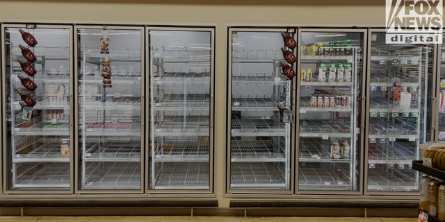 A freezer sits empty at a grocery store in Washington, D.C.