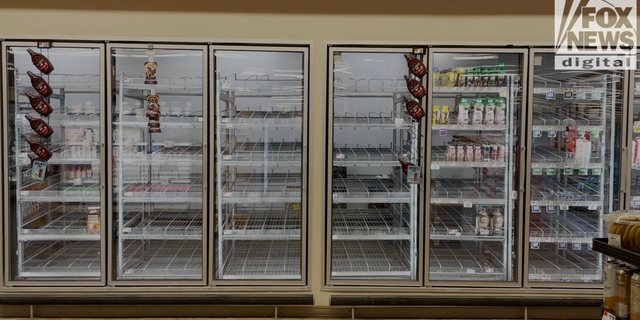 A freezer sits empty at a grocery store in Washington, D.C.