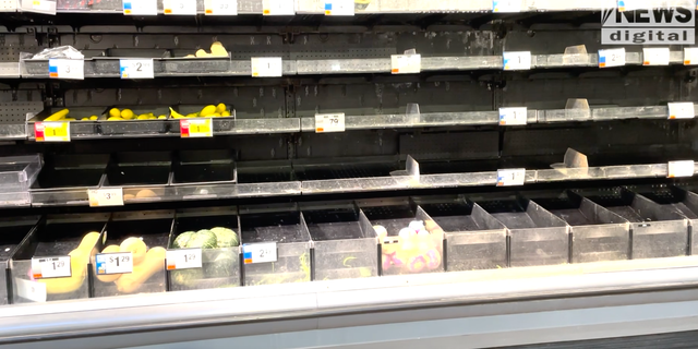 Almost empty produce shelves at a Giant grocery store.