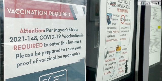 <strong>A restaurant in D.C. posts a sign requiring proof of vaccination.</strong>