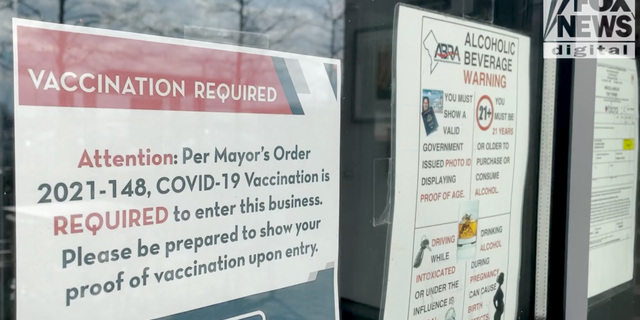 <strong>A restaurant in D.C. posts a sign requiring proof of vaccination.</strong>