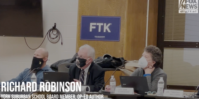 York Suburban School District board member Richard Robinson (center)