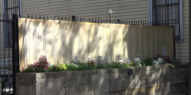 Hundreds of homicide victims are listed on a wall outside St. Anna's Episcopal Church in New Orleans. 