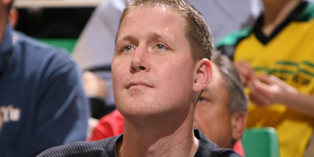 Shawn Bradley watches the game between the Utah Jazz and the Dallas Mavericks at EnergySolutions Arena on Feb. 1, 2010, in Salt Lake City, Utah.