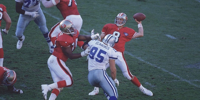 Niners QB Steve Young passes against Dallas Cowboys in San Francisco.